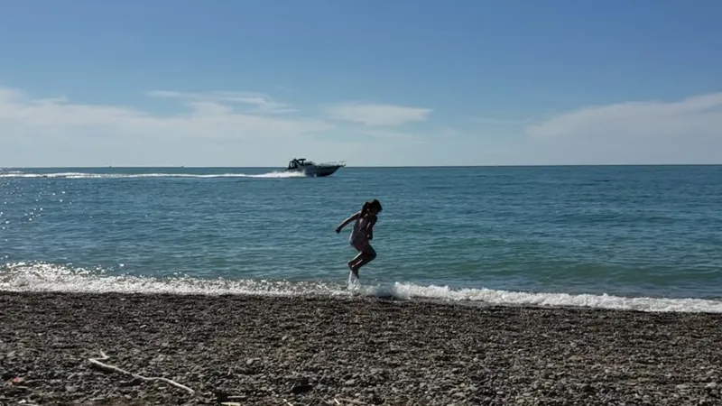 headlands beach sail boat