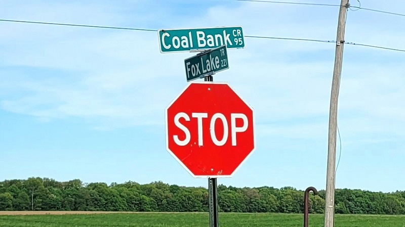 Coal Bank Road sign at its junction with Fox Lake Road.